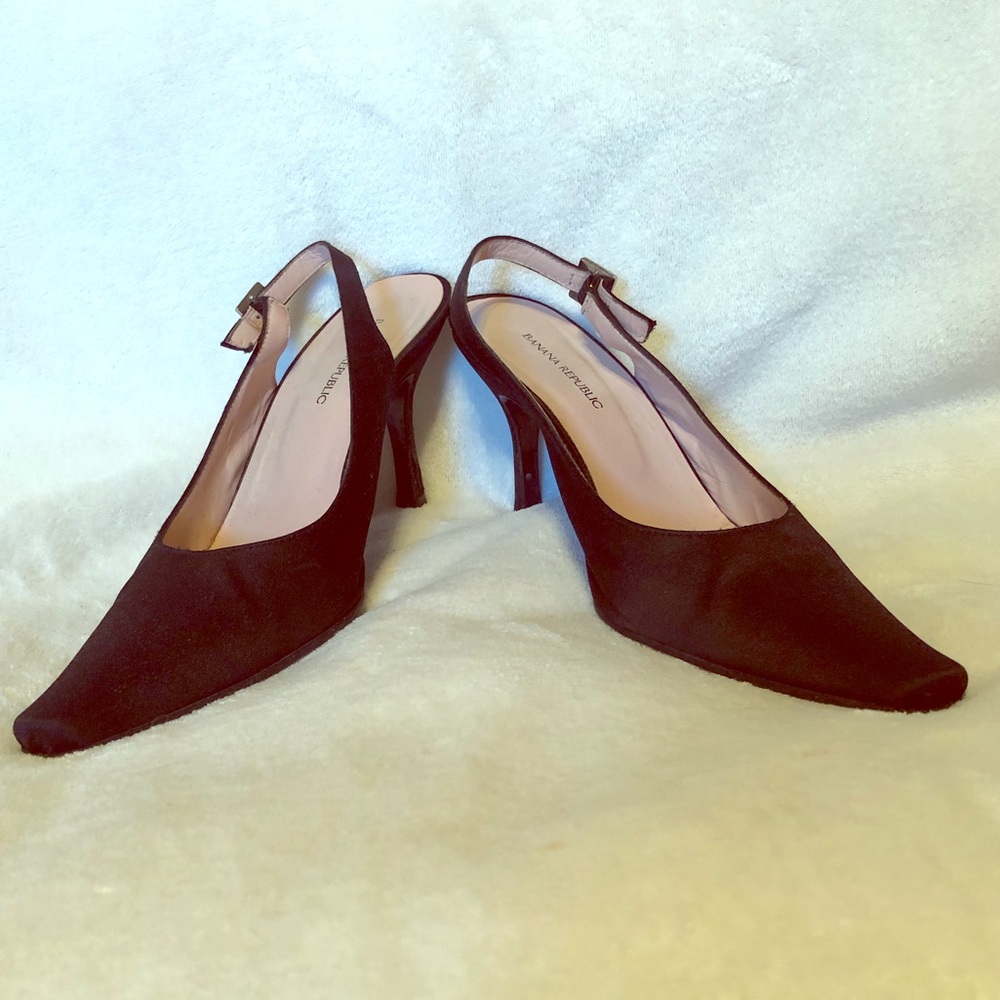 Black satin heels with rhinestone buckle.